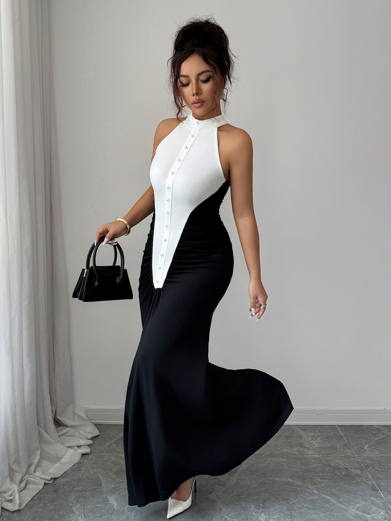 European Style Black White Spliced Maxi Dress | Halter Neck, Sleeveless, Pleated Skirt, Button Details, Elegant Wedding Guest Dress for Fall.