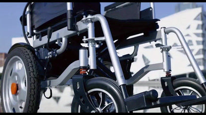 Foldable Electric Wheelchair Exclusively For Elderly -70-Pound Design For Effortless Carrying, Ideal For Seniors. Equipped With Electromagnetic Brakes For Secure Slope Stops And 15-Km Long-Range Battery For Extended Outings.