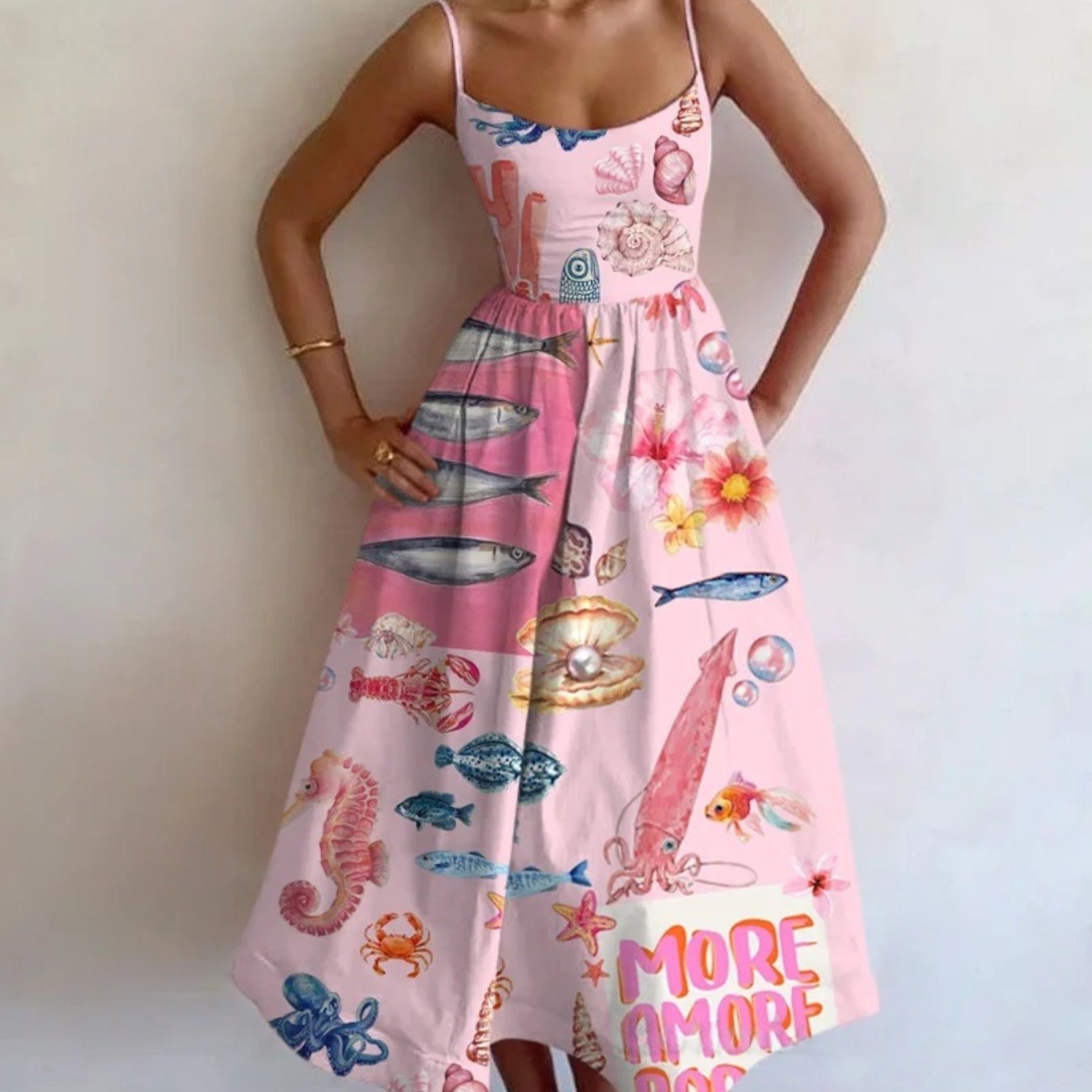 A Vacation Vibe with a Sleeveless Long Dress Featuring a Pink Marine Life Print And a Fitted Waist, Designed to Be Stretchy And Flattering, Suitable for Various Occasions