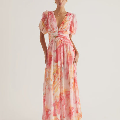 A Women'S Dress Featuring a Long Chiffon Skirt with a V-Neck And Short Sleeves, Designed with a High Waist And Print, Perfect for a Stylish And Refreshing Date Party Look
