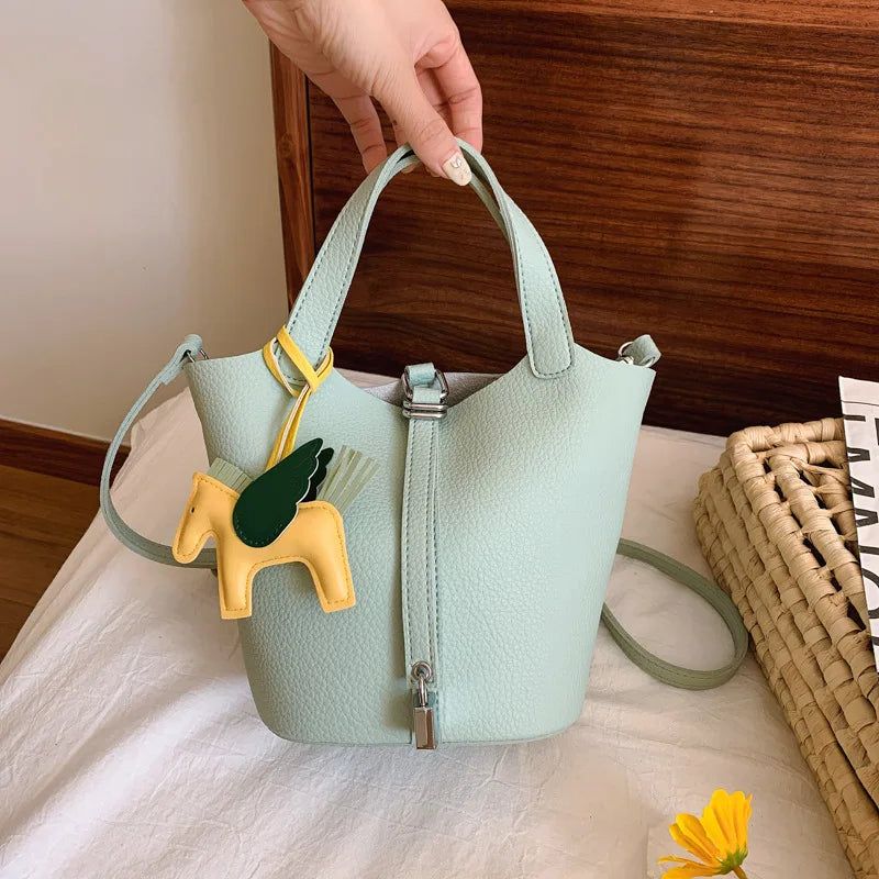Popular and popular lychee patterned mother and child bucket bag for women, 2025 new casual retro handbag, casual commuting bag