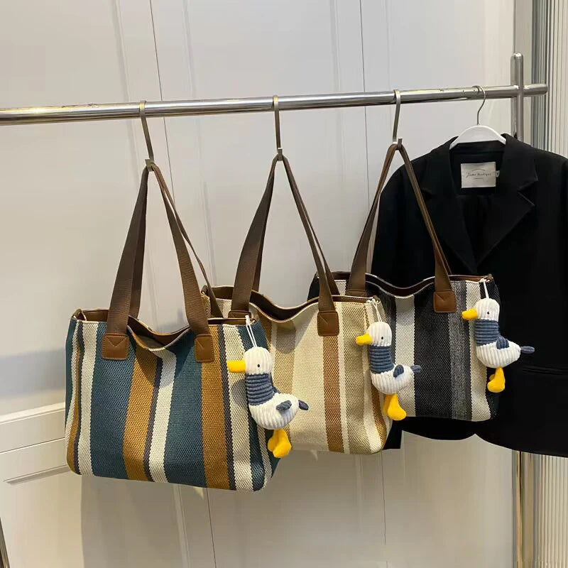 Tote Bag for Women Large Capacity Canvas Striped Shoulder Bag with Cute Pendant Commute Handbag Casual Versatile Crossbody Bag