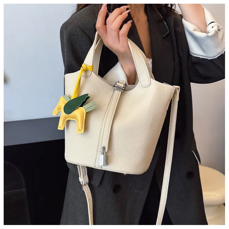 Popular and popular lychee patterned mother and child bucket bag for women, 2025 new casual retro handbag, casual commuting bag