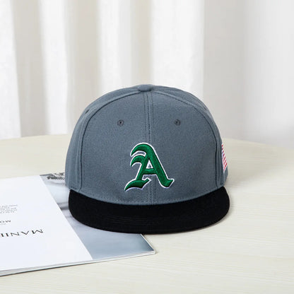 Hip-hop style baseball cap with a flat top, color patching, letter embroidery. Suitable for both women and men