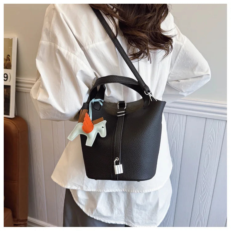 Popular and popular lychee patterned mother and child bucket bag for women, 2025 new casual retro handbag, casual commuting bag