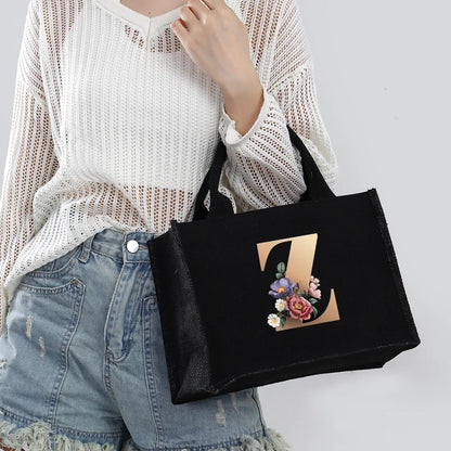 Black hand-held canvas bag, 26 letter printed women's handbag, large capacity portable leisure beach bag, indoor waterproof