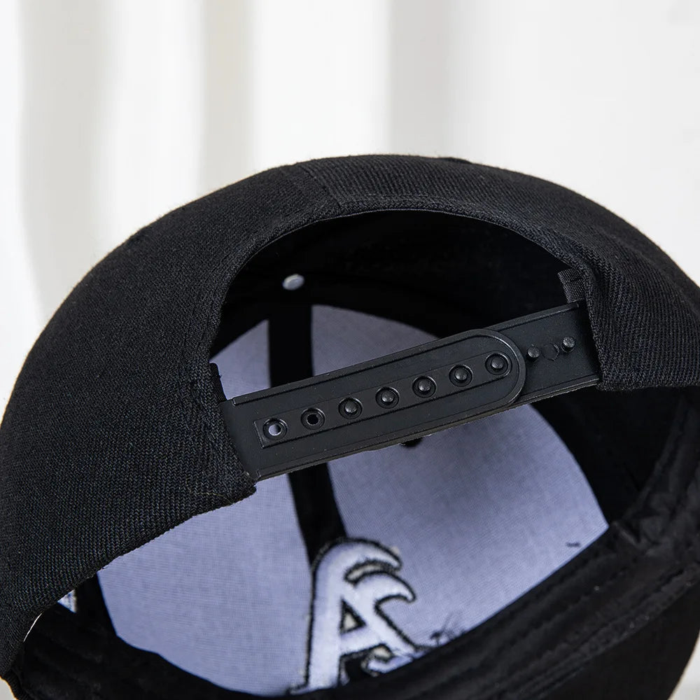 Hip-hop style baseball cap with a flat top, color patching, letter embroidery. Suitable for both women and men