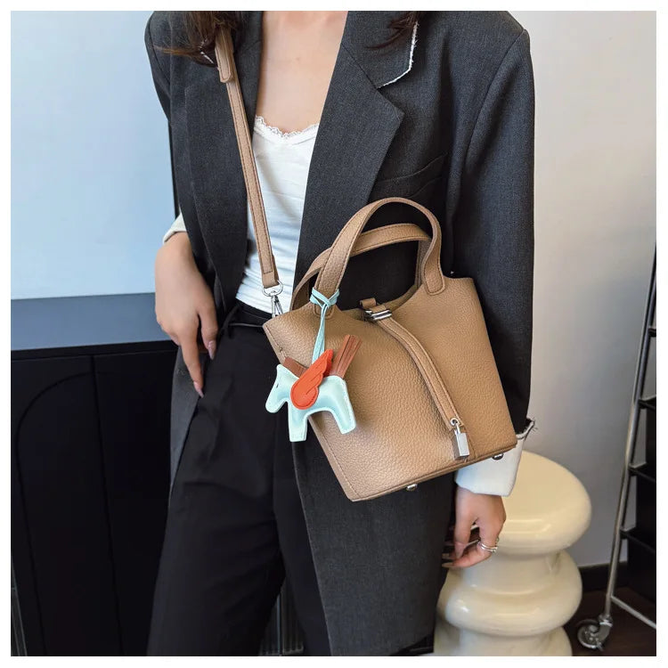 Popular and popular lychee patterned mother and child bucket bag for women, 2025 new casual retro handbag, casual commuting bag