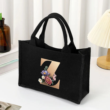 Black hand-held canvas bag, 26 letter printed women's handbag, large capacity portable leisure beach bag, indoor waterproof