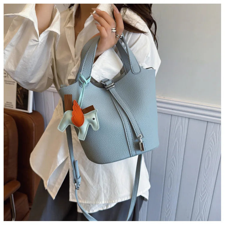 Popular and popular lychee patterned mother and child bucket bag for women, 2025 new casual retro handbag, casual commuting bag