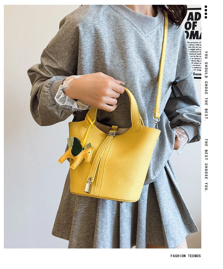 Popular and popular lychee patterned mother and child bucket bag for women, 2025 new casual retro handbag, casual commuting bag