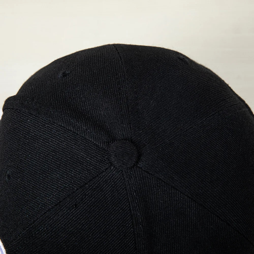 Hip-hop style baseball cap with a flat top, color patching, letter embroidery. Suitable for both women and men