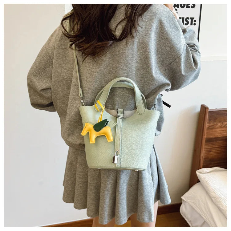 Popular and popular lychee patterned mother and child bucket bag for women, 2025 new casual retro handbag, casual commuting bag