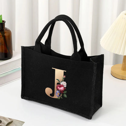 Black hand-held canvas bag, 26 letter printed women's handbag, large capacity portable leisure beach bag, indoor waterproof