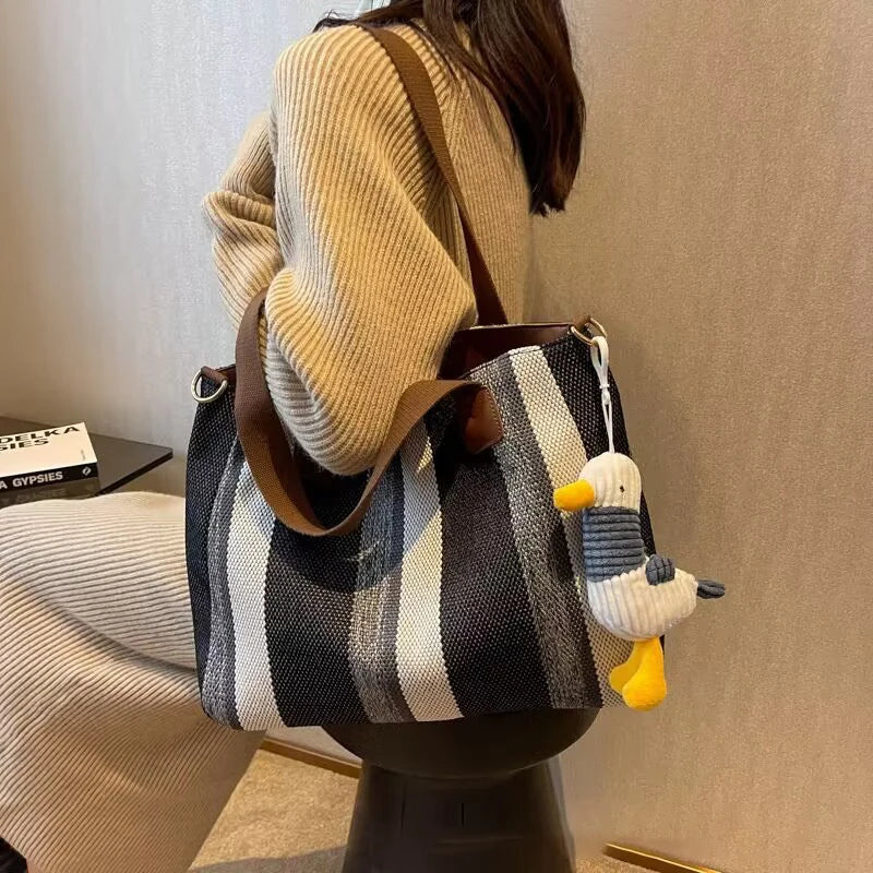 Tote Bag for Women Large Capacity Canvas Striped Shoulder Bag with Cute Pendant Commute Handbag Casual Versatile Crossbody Bag