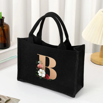 Black hand-held canvas bag, 26 letter printed women's handbag, large capacity portable leisure beach bag, indoor waterproof