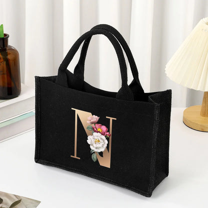 Black hand-held canvas bag, 26 letter printed women's handbag, large capacity portable leisure beach bag, indoor waterproof