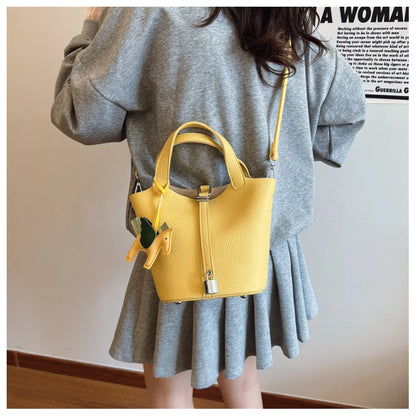 Popular and popular lychee patterned mother and child bucket bag for women, 2025 new casual retro handbag, casual commuting bag