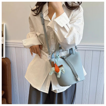 Popular and popular lychee patterned mother and child bucket bag for women, 2025 new casual retro handbag, casual commuting bag