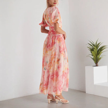 A Women'S Dress Featuring a Long Chiffon Skirt with a V-Neck And Short Sleeves, Designed with a High Waist And Print, Perfect for a Stylish And Refreshing Date Party Look