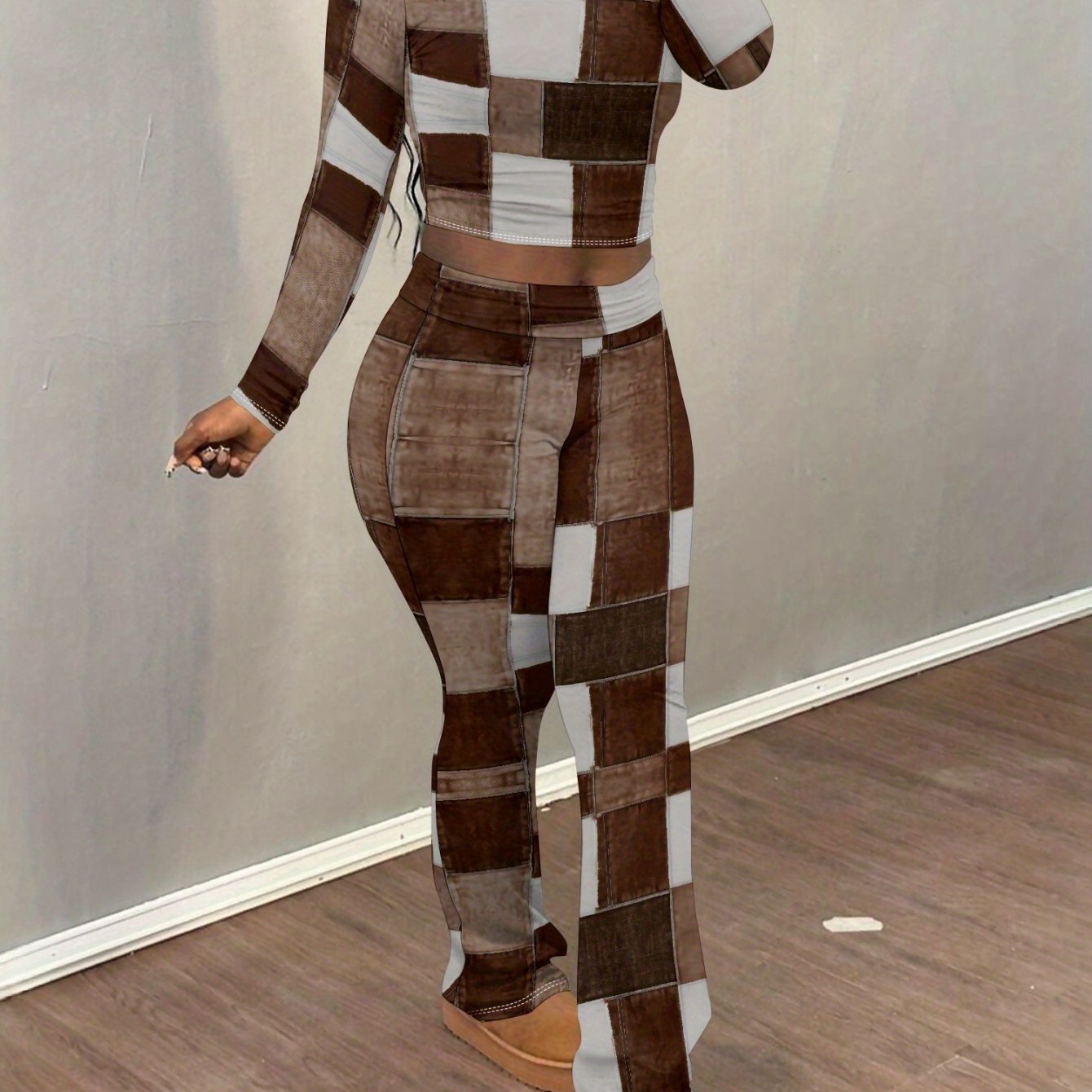 European and American style brown and white patchwork print two-piece set for women: long-sleeved cropped top + slightly flared trousers. Features visible stitching details for a unique and look.