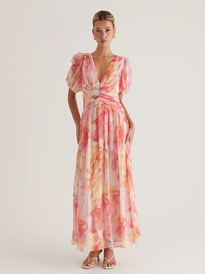 A Women'S Dress Featuring a Long Chiffon Skirt with a V-Neck And Short Sleeves, Designed with a High Waist And Print, Perfect for a Stylish And Refreshing Date Party Look