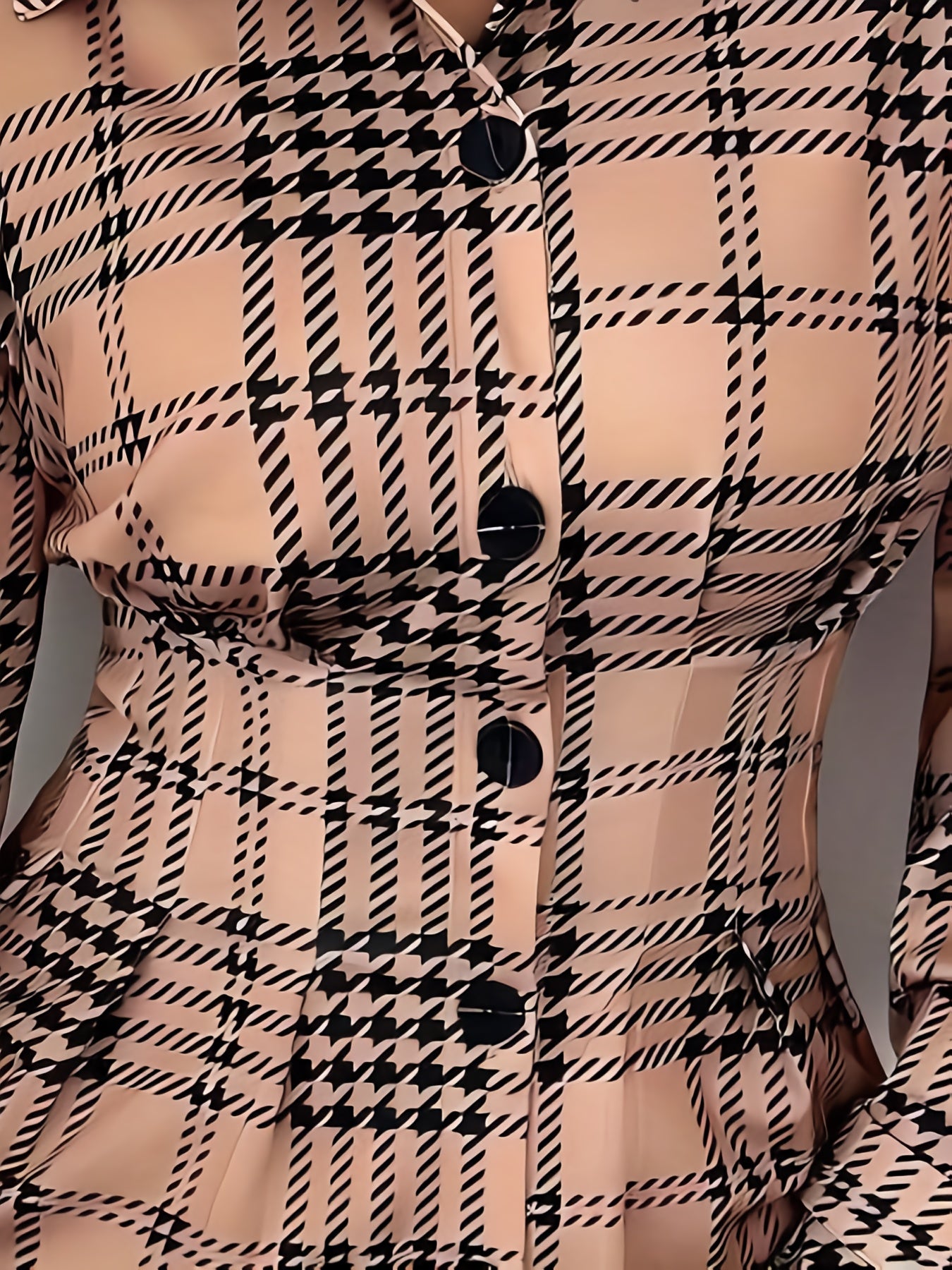 A Shirt Dress with a Houndstooth Pattern, Featuring Detailed Front Buttons And Pleats on The Front Placket.